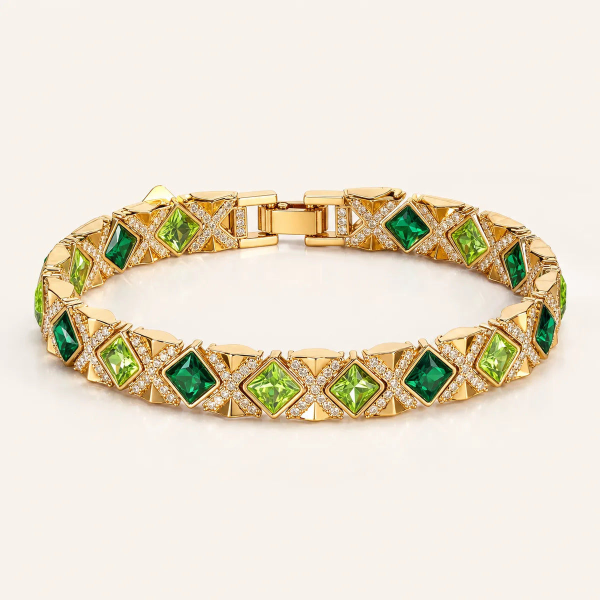 Gilded Epoch green statement bracelet with gold-tone geometric links on white background, 170 mm
