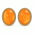 Vintage orange amber gold-plated oval earrings on a white background