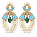 Pair of vintage blue enamel shell pearl earrings with green drops on a white background.