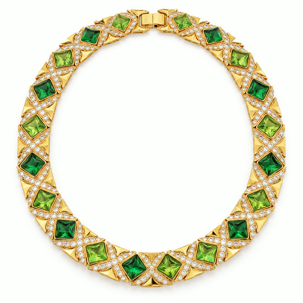 Vintage gold-plated necklace with alternating green rhinestones on a white background