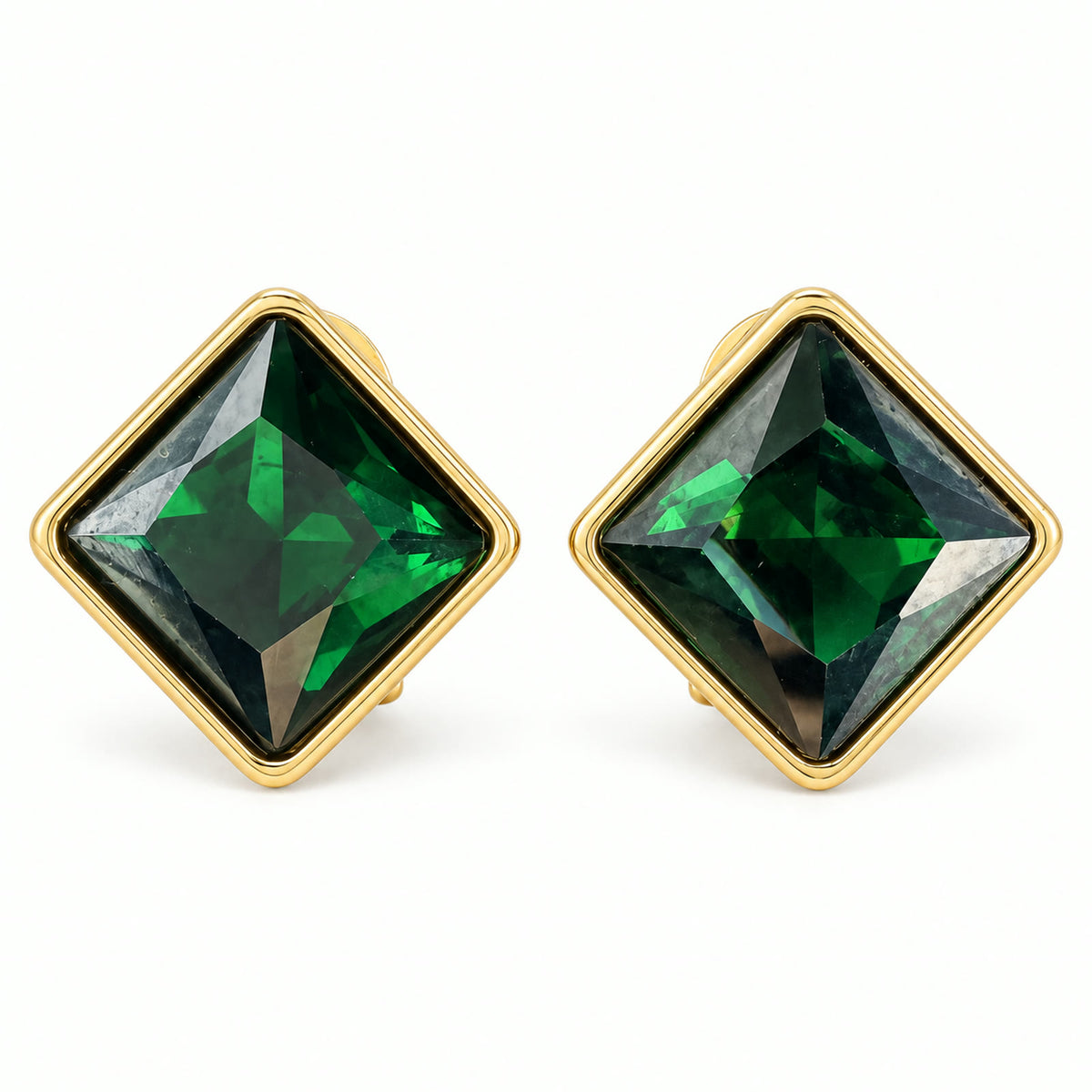 Vintage 17mm gold-plated square earrings with green rhinestones on a white background