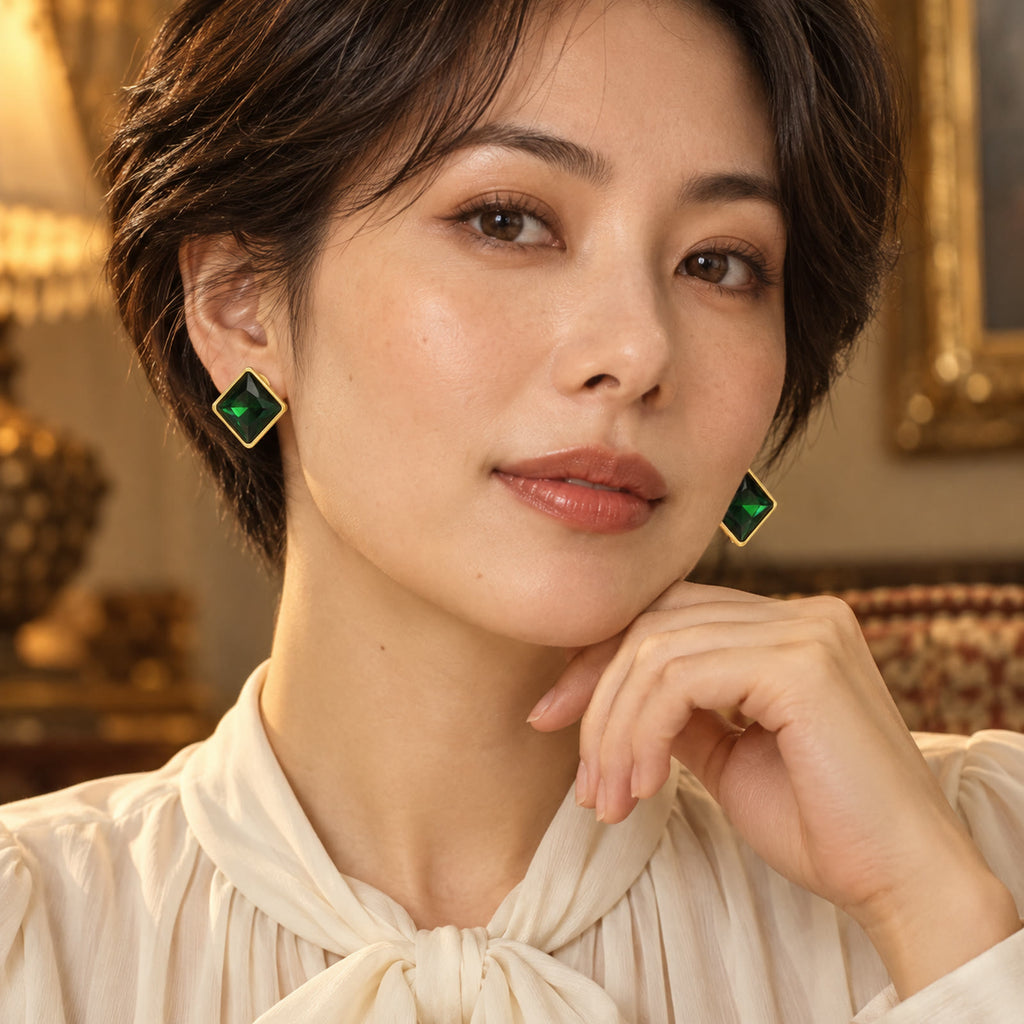Model wearing vintage gold-plated square earrings with green rhinestones